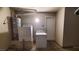 Laundry room with a new washer, dryer, and water heater at 37 Belle Soleil Ave, Las Vegas, NV 89123