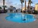 Community swimming pool features refreshing blue water, poolside seating, and a covered lounge area at 37 Belle Soleil Ave, Las Vegas, NV 89123