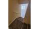 Carpeted staircase leading to a bright room with natural light at 37 Belle Soleil Ave, Las Vegas, NV 89123