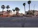 Neighborhood street view featuring lush palm trees and well-maintained homes on a sunny day at 37 Belle Soleil Ave, Las Vegas, NV 89123