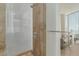 This modern bathroom has a glass enclosed shower and modern fixtures, all with amazing city views at 3722 Las Vegas Blvd # 3209, Las Vegas, NV 89158