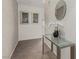 Elegant hallway featuring a glass console table, decorative mirror, and textured wall for a sophisticated entrance at 3722 Las Vegas Blvd # 3209, Las Vegas, NV 89158