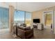 Inviting living room featuring expansive windows with panoramic city views, stylish furnishings, and contemporary design at 3722 Las Vegas Blvd # 3209, Las Vegas, NV 89158