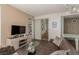 Modern living room featuring a stylish entertainment center, comfortable seating, and views into the bathroom at 3722 Las Vegas Blvd # 3209, Las Vegas, NV 89158