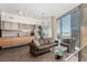 Contemporary living room with stainless steel kitchen, modern furnishings, and large windows offering stunning city views at 3722 Las Vegas Blvd # 3209, Las Vegas, NV 89158