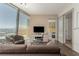 Chic living room with panoramic city views, contemporary furnishings, and glimpses into the adjacent bedroom and bathroom at 3722 Las Vegas Blvd # 3209, Las Vegas, NV 89158