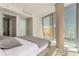 A serene main bedroom with natural light, neutral tones and amazing views of the Las Vegas cityscape at 3722 Las Vegas Blvd # 3209, Las Vegas, NV 89158
