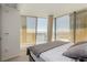 This spacious main bedroom features a modern aesthetic with large windows, and scenic views of the city at 3722 Las Vegas Blvd # 3209, Las Vegas, NV 89158