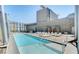 Large outdoor pool with multiple lounge chairs and city views, an ideal space for enjoying the sunshine at 3722 Las Vegas Blvd # 3209, Las Vegas, NV 89158
