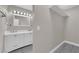 Bright bathroom area with double vanity, tile floor and closet area at 3944 Visby Ln, Las Vegas, NV 89119