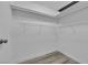Walk-in closet with white wire shelving and wood-look flooring at 3944 Visby Ln, Las Vegas, NV 89119