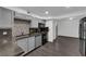 This kitchen features gray cabinets, stainless steel appliances, and a tile backsplash at 3944 Visby Ln, Las Vegas, NV 89119