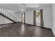 Open living space with hardwood floors and stairs at 3944 Visby Ln, Las Vegas, NV 89119