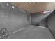 Covered patio with textured grey floor, grey walls, and a small window at 3944 Visby Ln, Las Vegas, NV 89119