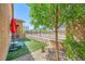 This cozy backyard features a small lawn, landscaping, and patio with seating, perfect for a relaxing outdoor experience at 412 Middlestone Ave, Henderson, NV 89011