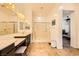 Bathroom featuring double sinks, vanity, tile floors, and glass shower at 412 Middlestone Ave, Henderson, NV 89011