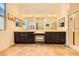 Bright bathroom featuring double sinks, vanity, tile floors, and glass shower at 412 Middlestone Ave, Henderson, NV 89011