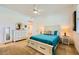 Bedroom with ceiling fan, bedside lamps, dresser, and coastal-themed decor at 412 Middlestone Ave, Henderson, NV 89011