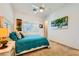 Cozy bedroom with a ceiling fan and tropical themed decor at 412 Middlestone Ave, Henderson, NV 89011