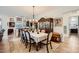 Stylish dining area with seating for eight and seamless transition to living and kitchen spaces at 412 Middlestone Ave, Henderson, NV 89011