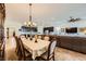 Open-concept dining area with decorative chandelier flowing into the kitchen and living room at 412 Middlestone Ave, Henderson, NV 89011