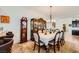 Formal dining room with stylish decor, wooden furniture, and a seamless transition to a modern kitchen at 412 Middlestone Ave, Henderson, NV 89011