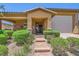 Attractive home with a brick walkway, covered porch, and a two-car garage at 412 Middlestone Ave, Henderson, NV 89011