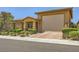 Charming home with a well-maintained lawn, covered porch, and a spacious two-car garage at 412 Middlestone Ave, Henderson, NV 89011
