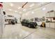 Spacious three car garage with epoxy flooring, storage cabinets and car at 412 Middlestone Ave, Henderson, NV 89011