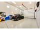 Spacious garage with epoxy flooring, car, and lots of wall storage at 412 Middlestone Ave, Henderson, NV 89011