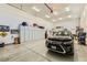 Bright garage with epoxy floors, car, and storage at 412 Middlestone Ave, Henderson, NV 89011