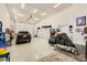 Spacious garage with epoxy flooring, storage cabinets, and vehicle at 412 Middlestone Ave, Henderson, NV 89011