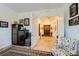 Hallway boasts tile floors, a decorative cabinet, and an accent chair at 412 Middlestone Ave, Henderson, NV 89011