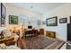 Cozy home office with vintage furniture, patterned area rug, and decorative wall art at 412 Middlestone Ave, Henderson, NV 89011