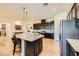 Bright kitchen featuring granite countertops, stainless appliances and dark cabinetry at 412 Middlestone Ave, Henderson, NV 89011