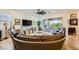 Bright living room featuring a plush sectional sofa, entertainment center, and sliding doors to the patio at 412 Middlestone Ave, Henderson, NV 89011