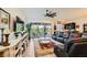 Spacious living room with stylish decor, large sliding glass doors, and comfortable leather seating at 412 Middlestone Ave, Henderson, NV 89011