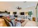 Open-concept living room with a comfortable leather sofa and kitchen, perfect for modern living and entertaining at 412 Middlestone Ave, Henderson, NV 89011
