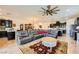 Expansive living area with comfortable seating, an area rug, and seamlessly connected kitchen and dining spaces at 412 Middlestone Ave, Henderson, NV 89011