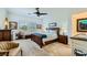 Main bedroom with ceiling fan, neutral decor, and ensuite bathroom access at 412 Middlestone Ave, Henderson, NV 89011