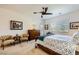 Comfortable primary bedroom with a bed, dressers, and natural lighting at 412 Middlestone Ave, Henderson, NV 89011