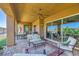 Spacious covered patio with comfortable seating and outdoor dining area, perfect for relaxing and entertaining at 412 Middlestone Ave, Henderson, NV 89011