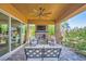 Outdoor patio with seating, a ceiling fan, and a beautiful fireplace at 412 Middlestone Ave, Henderson, NV 89011