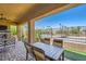 The patio features a stone fireplace, comfortable seating, and an outdoor dining area for relaxing and entertaining at 412 Middlestone Ave, Henderson, NV 89011