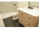 Bathroom featuring black tiled floors, a toilet, and wooden vanity with white countertop at 4277 Rimcrest Rd, Las Vegas, NV 89121