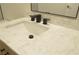 Bathroom vanity featuring a marble countertop, black faucet, and modern cabinetry at 4277 Rimcrest Rd, Las Vegas, NV 89121