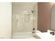 Updated bathroom features modern tiles, black fixtures, and a combined shower and tub at 4277 Rimcrest Rd, Las Vegas, NV 89121