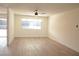 Spacious bedroom with new floors, a large window, and plenty of natural light at 4277 Rimcrest Rd, Las Vegas, NV 89121