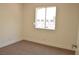 Neutral bedroom with carpeted floors, window, and door at 4277 Rimcrest Rd, Las Vegas, NV 89121