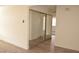 Hallway showcasing modern flooring and closet with large sliding mirror doors at 4277 Rimcrest Rd, Las Vegas, NV 89121